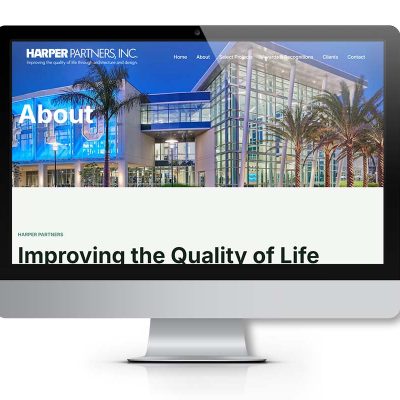 Harper Partners about page displayed on a desktop monitor