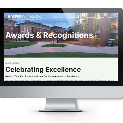 Harper Partners awards page displayed on a desktop monitor